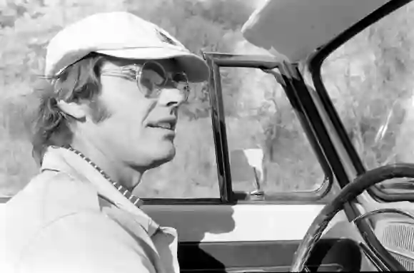 Close-up  of  American  film  actor  Jack  Nicholson,  in  a  cap  and  sunglasses,  as  he  drives