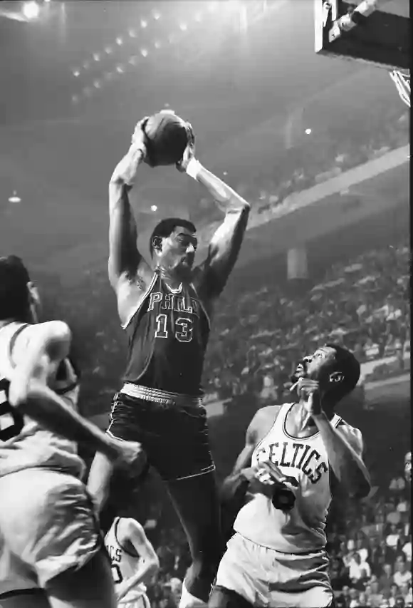 Basketball:  Philadelphia  76ers  Wilt  Chamberlain  #13  in  action,  rebounding  vs  Boston  Celti