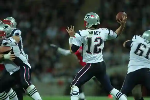 Wembley,  London,  England:  Tom  Brady  prepares  to  throw  a  pass  during  the  annual  National