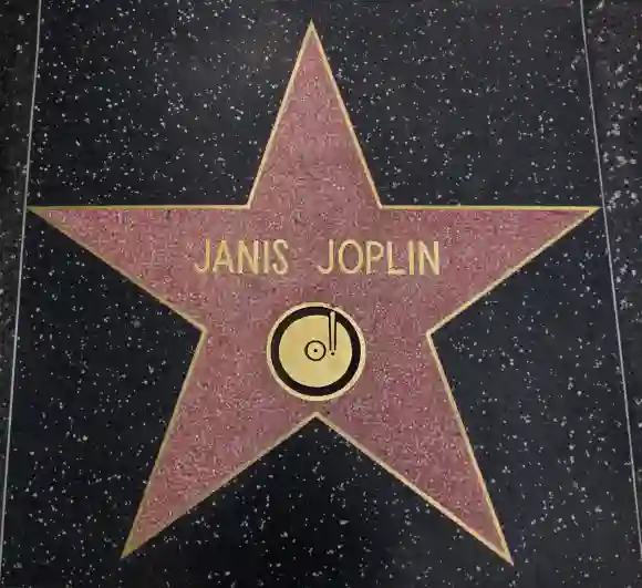 Janis Joplin star on the Walk of Fame, HOLLYWOOD,CA - DECEMBER 19, 2013: Janis Joplin tribute on the Walk of Fame. This