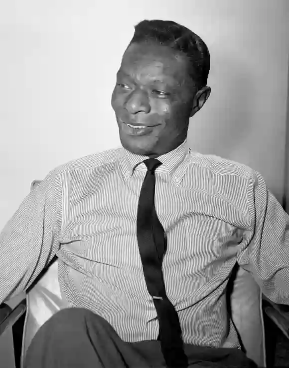 Syndication: The Tennessean Nat King Cole answers some reporter™s question before his show in Nashville on Oct. 28, 1963