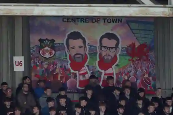 A mural of Ryan Reynolds and Rob McElhenney at the Stok Cae Ras AFC Wrexham v Colchester United, EFL Sky Bet League Two,