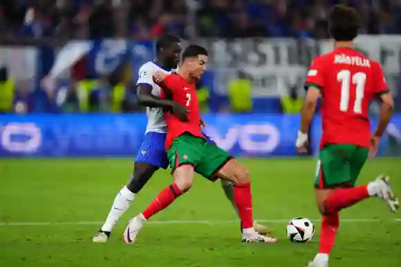 GER: Portugal v France. UEFA EURO, EM, Europameisterschaft,Fussball 2024 Cristiano Ronaldo of Portugal and Dayot Upameca