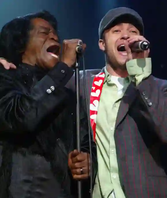 James Brown and Justin Timberlake perform during the Will.i.am Music Group's Tsunami Benefit Concert at the on February 11, 2005, in Hollywood, California.