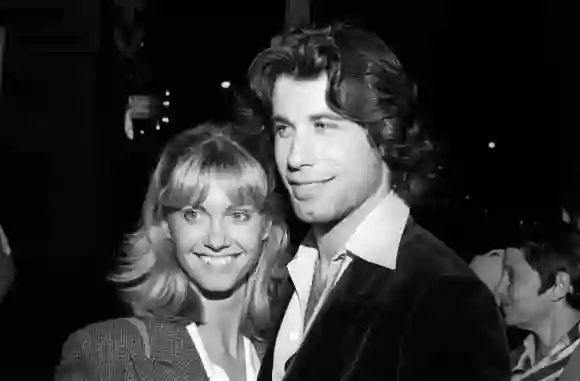 **FILE PHOTO** Olivia Newton-John Has Passed Away. Olivia Newton-John and John Travolta at The Palm Restaurant in Beverl