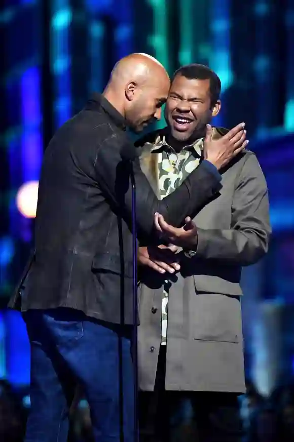 Keegan Michael-Key and Jordan Peele speak onstage during the 2016 MTV Movie Awards.
