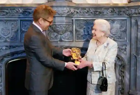 Queen Elizabeth II receives an honorary Bafta from actor and director Kenneth Branagh, April 4, 2013.