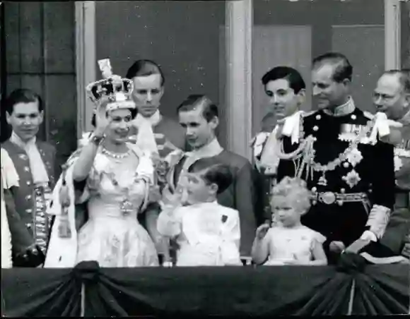 Coronation of Queen Elizabeth II in 1953 with King Philip and the children Prince Charles and Princess Anne. They wave from the balcony of Buckingham Palace in London.