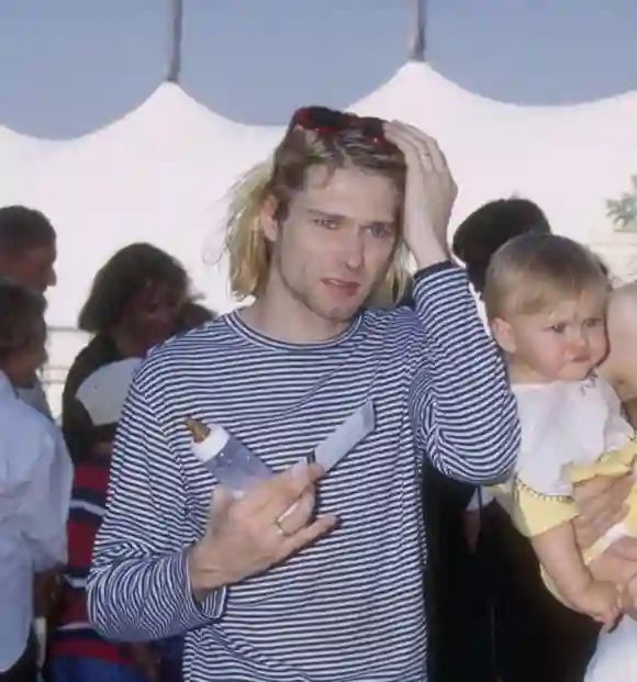 Kurt Cobain in 1993 with his daughter