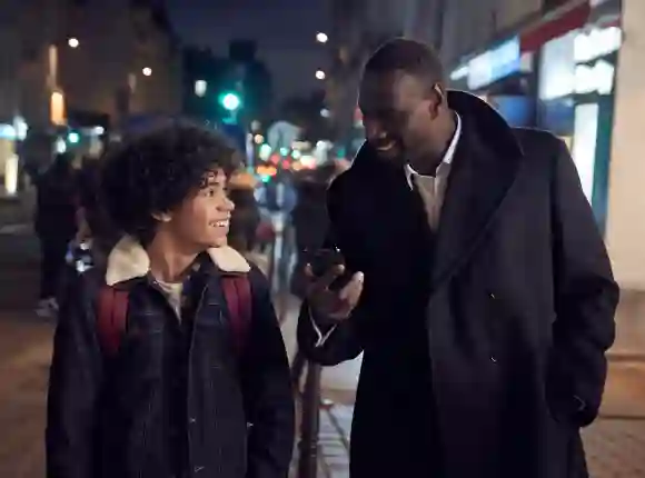 Omar Sy as "Assane Diop" and Etan Simon as "Raoul" in the Netflix series 'Lupin'
