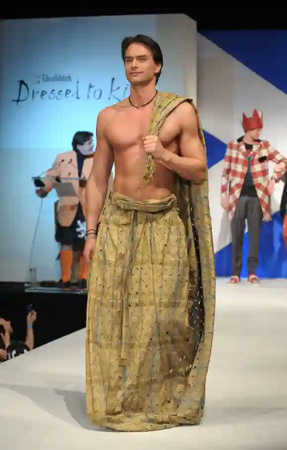 Marcus Schenkenberg walks the runway at the 8th annual "Dressed To Kilt" Charity Fashion Show, NYC, 2010.
