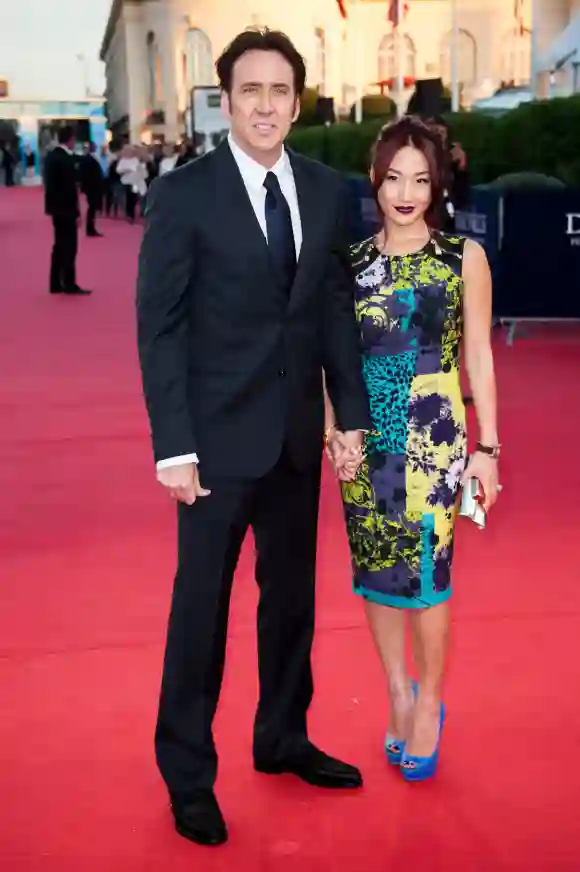 Nicolas Cage and Alice Kim arrive at the premiere of the movie 'Joe' on September 2, 2013
