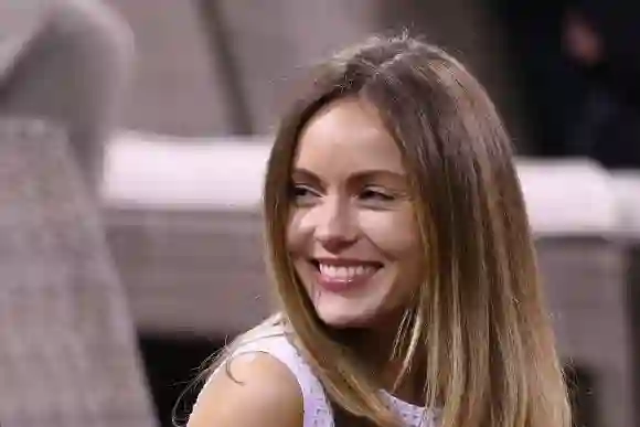 Nikita Khan smiles as she watches the tennis during day four of the BNP Paribas Open, March 10, 2016.