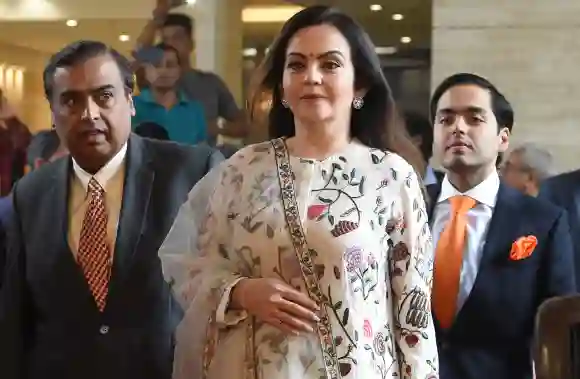 Mukesh Ambani along with his wife Nita Ambani and their son Anant Ambani arrive for the company's 41st AGM, July 5, 2018.