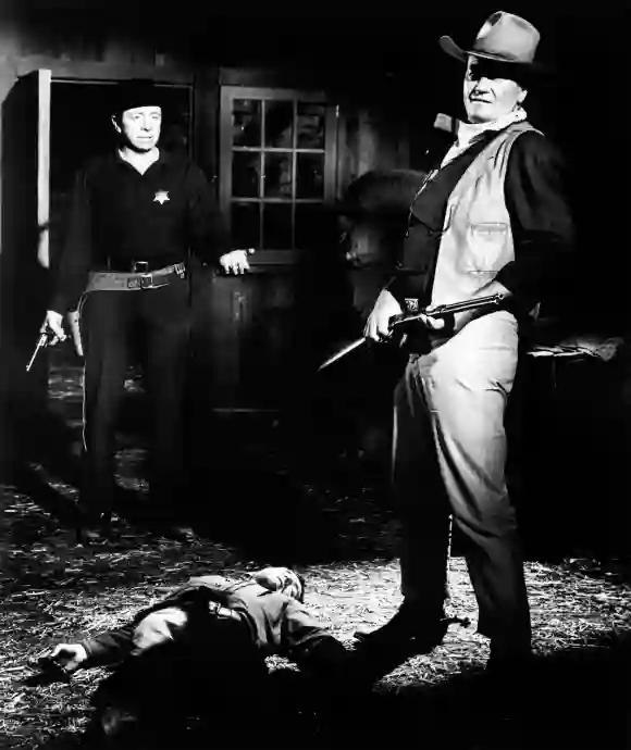 Paul Fix and John Wayne in 'The Sons of Katie Elder'