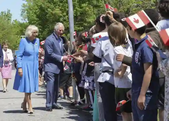 Prince Charles, Prince of Wales and Camilla, Duchess of Cornwall meet and greet local schoolchildren of Assumption School on day two of their Platinum Jubilee Royal Tour of Canada, May 18, 2022.