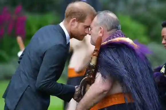 Prince Harry receives a 'hongi', or traditional Maori greeting, from an elder during an official welcoming ceremony at Government House in Wellington