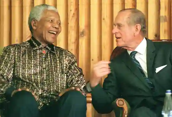 Former South African president Nelson Mandela (L) chats with the Duke of Edinburgh, Prince Philip at Drakenstein Prison, Paarl about 50 kms outside of Cape Town 05 November 2000.