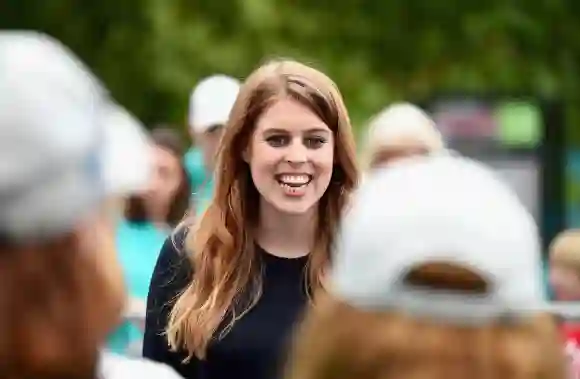 Princess Beatrice of York greets guests during "The Patron's Lunch" celebrations for the queen's 90th birthday, June 12, 2016.