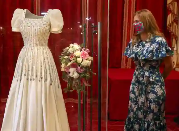 Princess Beatrice poses alongside her wedding dress as it goes on display at Windsor Castle, September 23, 2020.