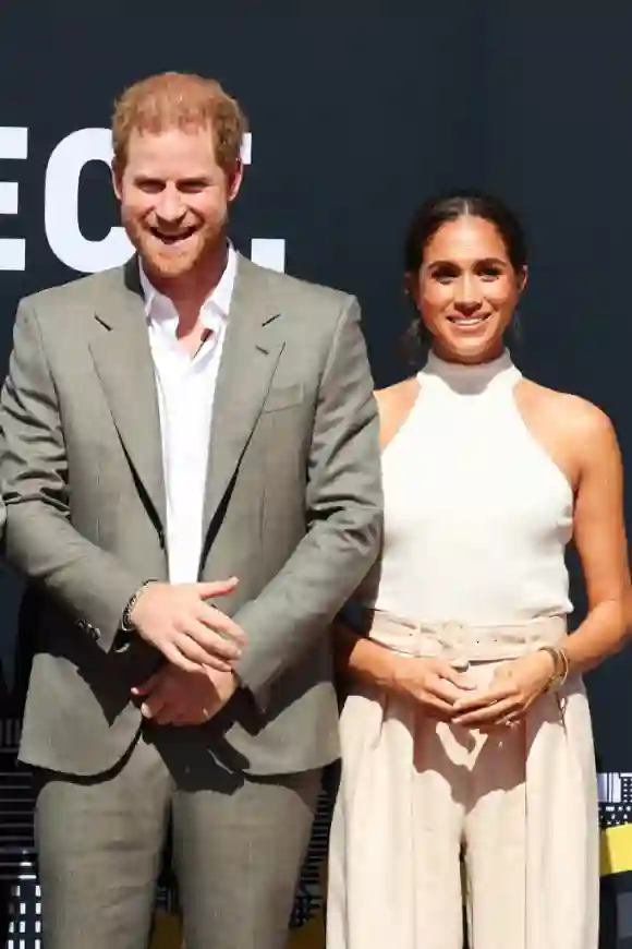 Prince Harry and Duchess Meghan look super happy