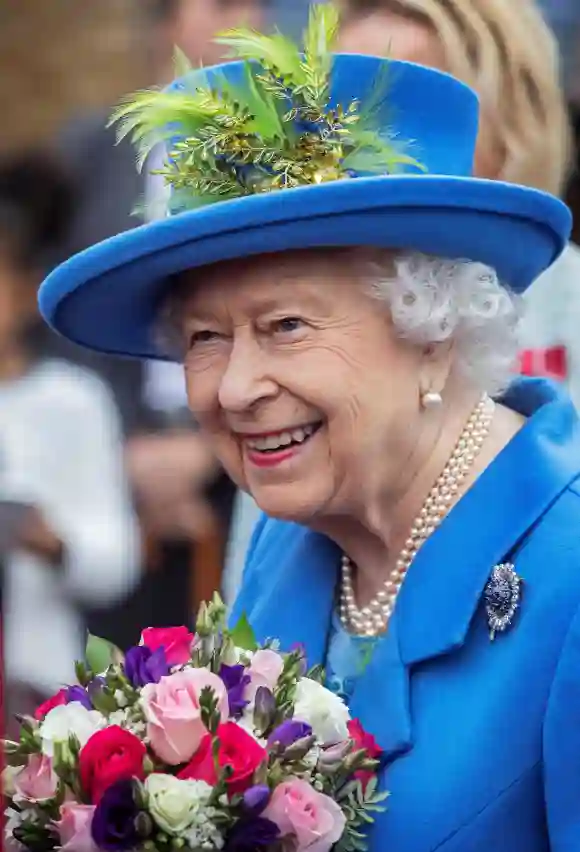 Queen Elizabeth II reacts as she visits the Haig Housing Trust in Morden, southwest London, on October 11, 2019, to open their new veteran housing development.