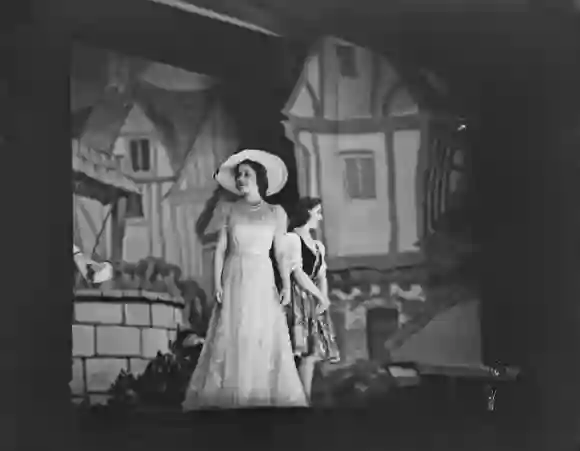 Queen Elizabeth II and Princess Margaret on stage during the Christmas pantomime 'Old mother red riding boots' at Windsor Castle, England on December 23, 1944.