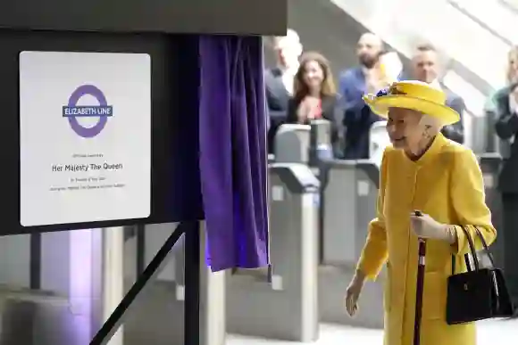 Queen Elizabeth II unveils a plaque to mark the Elizabeth line's official opening at Paddington Station, May 17, 2022.