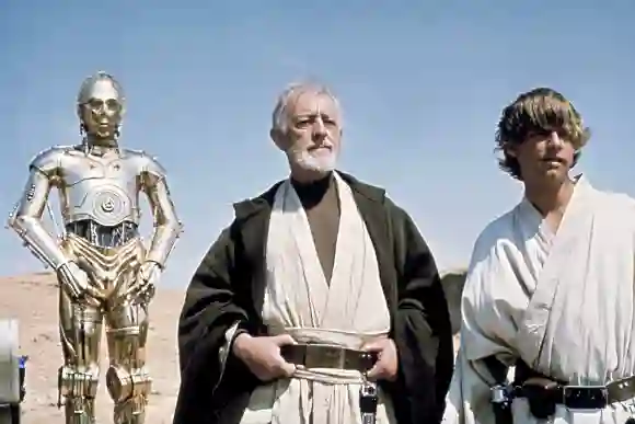 "C-3PO", Sir Alec Guinness and Mark Hamill in Star Wars - A New Hope.