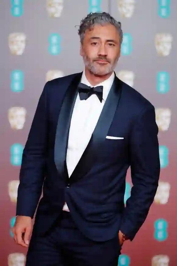 Taika Waititi poses on the red carpet upon arrival at the BAFTA British Academy Film Awards, February 2, 2020.