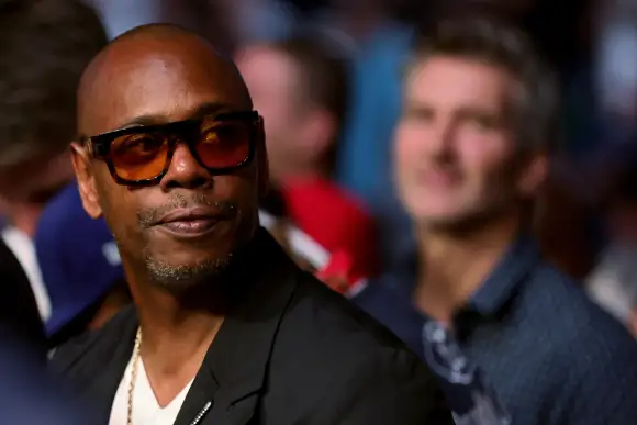 Dave Chappelle looks on during UFC 264: Poirier v McGregor 3 at T-Mobile Arena.