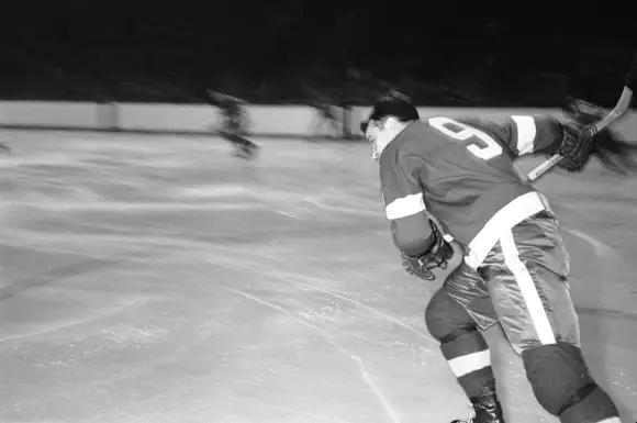 Canadian  ice  hockey  player  Gordie  Howe,  of  the  Detroit  Red  Wings,  on  the  ice  during  a