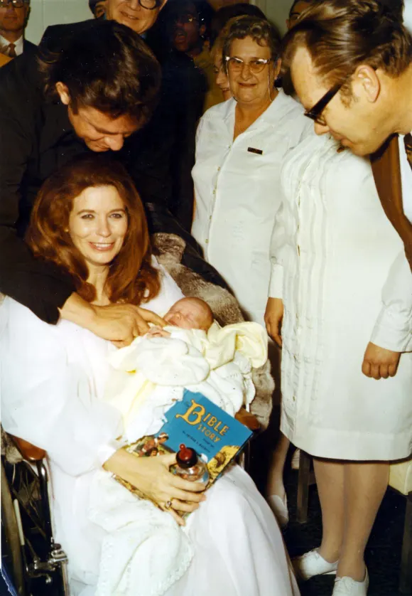 JUNE CARTER CASH AND HUSBAND JOHNNY CASH.WITH THEIR NEW BABY.