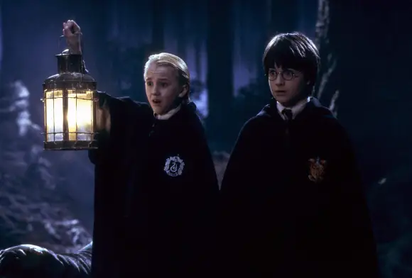 HARRY POTTER AND THE SORCERER'S STONE, Tom Felton, Daniel Radcliffe, 2001. Photo: Peter Mountain / ? Warner Bros. / Courtesy