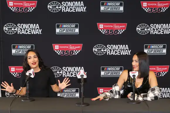 SONOMA, CA - JUNE 12: Professional tag team wrestlers The Bella Twins, Brie Bella (left) and Nikki Bella (right) during