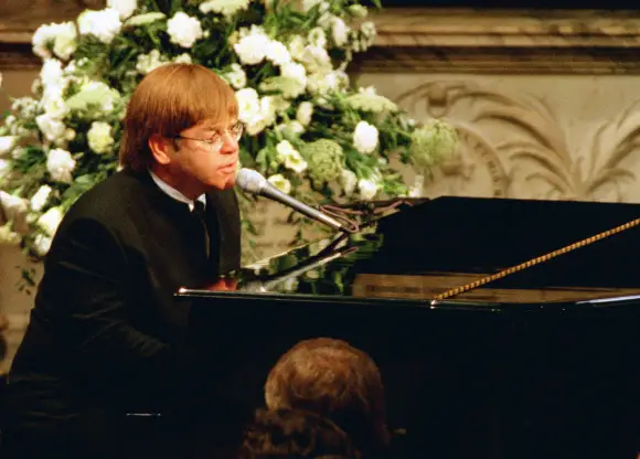 Elton John performs "Candle In The Wind" at Lady Diana's funeral on September 6, 1997
