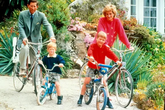 Prince Charles, Prince Harry, Prince William, and Princess Diana on a bike ride