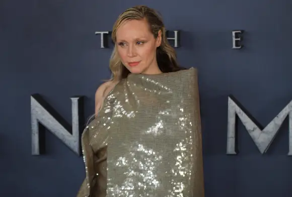Gwendoline Christie in a glittery dress at the "Sandman" premiere