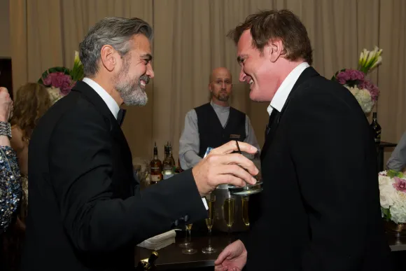 Producer, George Clooney, Oscar winner for best picture for Argo congratulates Quentin Tarantino, Oscar winner for origi