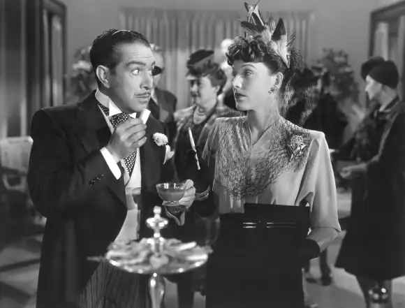 January 19, 2021, USA: Cesar Romero, Rose Hobart, on-set of the Film, A Gentleman at Heart , 20th Century-Fox, 1942 USA