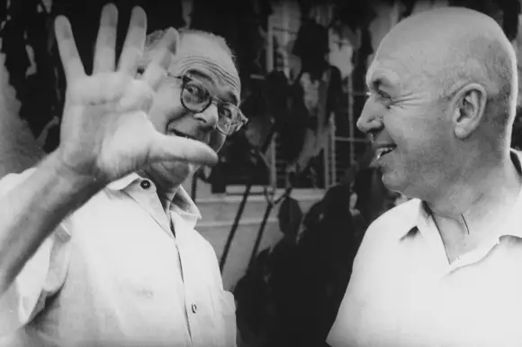 Directors  Billy  Wilder  (L)  and  Otto  Preminger  meeting  on  the  set  of  Preminger's  film  P
