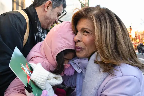 November 23, 2023, New York, New York, USA: NBC host HODA KOTB hugs a fan as tens of thousands lined the streets of NYC