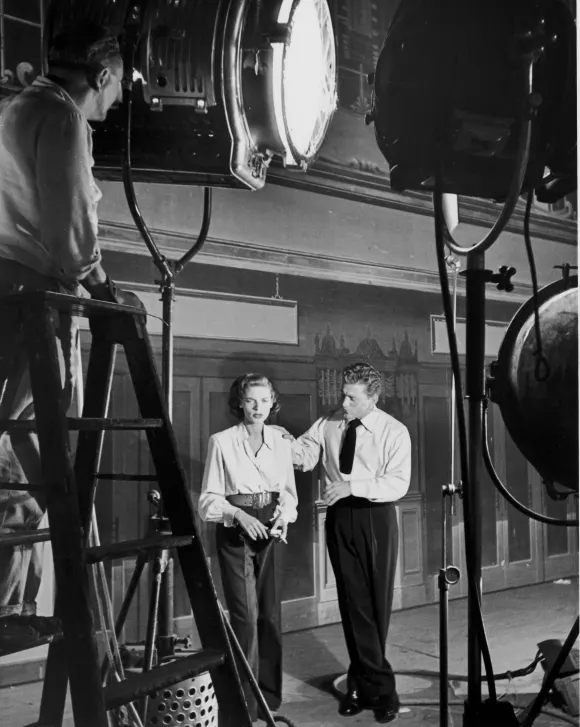 Actors Lauren Bacall and Kirk Douglas on the set of movie,  Young Man with a Horn.Alfred Eisenstae