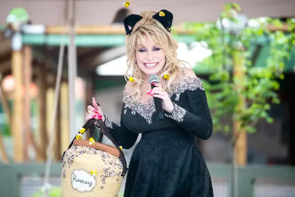 Syndication: The Knoxville News-Sentinel Dolly Parton is dressed as a black bear for the grand opening of the Big Bear M
