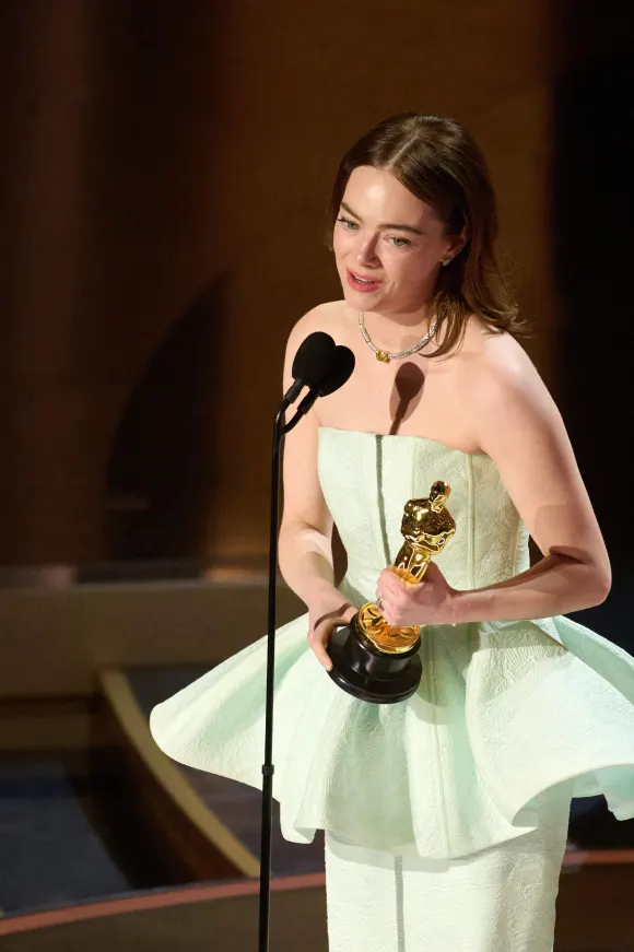 Emma Stone accepts the Oscar® for Actress in a Leading Role during the live ABC telecast of the 96th Oscars® at the Do
