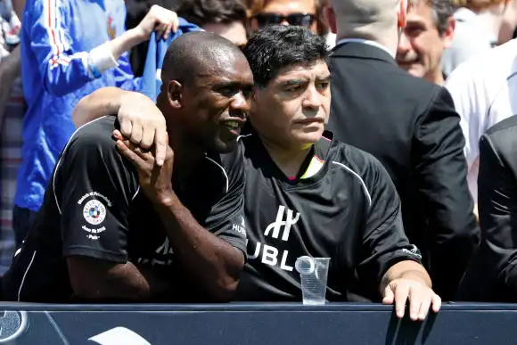Football legend Diego Maradona and former Netherlands national soccer player Clarence Seedorf attend an advertising even