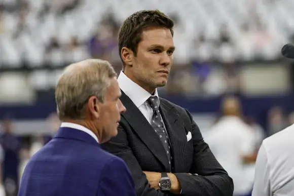 ARLINGTON, TX - SEPTEMBER 22: FOX football analyst Tom Brady visits with the players before the game between the Dallas