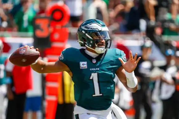 September 29, 2024, Tampa, Florida, USA: Philadelphia Eagles quarterback Jalen Hurts (1) throws a pass, while while the