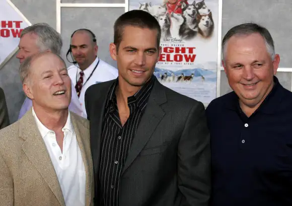 Frank Marshall, Paul Walker and guest at the World Premiere of Eight Below held at the El Capitan Th