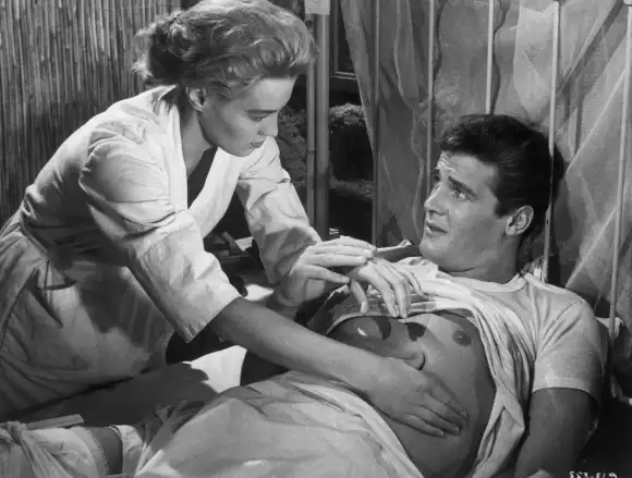 Angie Dickinson and Roger Moore in 'The Sins of Rachel Cade'